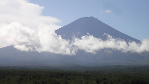 mount fuji with bright sunlit clouds